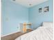 Bright bedroom featuring a desk, plush carpet, and coastal-themed wall art at 140 Coco Plum, Davenport, FL 33897
