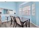 Inviting breakfast nook with bright natural light and modern bar stool seating at 140 Coco Plum, Davenport, FL 33897