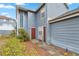 Charming two-story home with well-kept landscaping and blue siding at 140 Coco Plum, Davenport, FL 33897