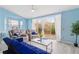 Cozy living room with sliding doors and modern furniture arrangement at 140 Coco Plum, Davenport, FL 33897