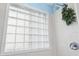 Glass block window in the bathroom provides natural light to the tiled shower at 140 Coco Plum, Davenport, FL 33897
