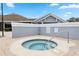 Relaxing spa with tiled steps and a handrail for easy access at 140 Coco Plum, Davenport, FL 33897