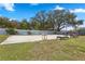 Sand volleyball court with lounge chairs and a playground in the background at 140 Coco Plum, Davenport, FL 33897