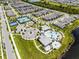 Aerial view of the community amenities including a pool, tennis courts, and well-maintained landscaping at 14218 Lanikai Beach Dr, Orlando, FL 32827
