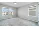 Well-lit bedroom with three windows providing ample natural light and neighborhood views at 14218 Lanikai Beach Dr, Orlando, FL 32827
