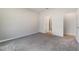 Comfortable bedroom featuring plush carpeting and an open door to an ensuite bathroom at 14218 Lanikai Beach Dr, Orlando, FL 32827