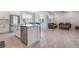 Modern kitchen with white cabinets, stainless steel appliances, and an island at 14218 Lanikai Beach Dr, Orlando, FL 32827