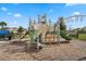 Community playground featuring modern climbing structures, slides, and a swing set for hours of fun at 14218 Lanikai Beach Dr, Orlando, FL 32827