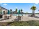 Resort-style community pool area with lounge chairs and shaded tables for relaxation at 14218 Lanikai Beach Dr, Orlando, FL 32827