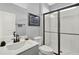 Modern bathroom featuring sleek fixtures and a glass-enclosed shower at 15245 Blue Peacock Ln, Winter Garden, FL 34787
