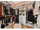 Well-organized walk-in closet with custom shelving, drawers, and ample storage space at 15245 Blue Peacock Ln, Winter Garden, FL 34787