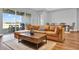 Comfortable living room with large sectional sofa, stylish coffee table, and sliding glass doors at 15245 Blue Peacock Ln, Winter Garden, FL 34787