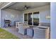 Covered outdoor patio with comfortable seating area at 15245 Blue Peacock Ln, Winter Garden, FL 34787