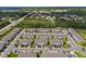 Aerial view of a well-planned community with townhomes, green spaces, and convenient access to nearby amenities at 2052 Milkweed St, Ocoee, FL 34761
