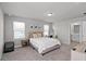 Bright bedroom featuring carpet floors, neutral walls, and two windows offering plenty of natural light at 2052 Milkweed St, Ocoee, FL 34761