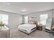 Bright bedroom featuring carpet floors, neutral walls, and two windows offering plenty of natural light at 2052 Milkweed St, Ocoee, FL 34761