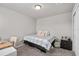 Cozy bedroom with a bed, desk, nightstand, and carpet flooring for a comfortable living space at 2052 Milkweed St, Ocoee, FL 34761