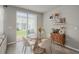 The dining area features a glass table, and a sliding door to the outdoor space at 2052 Milkweed St, Ocoee, FL 34761