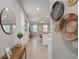 Inviting hallway with stylish decor, offering a glimpse into the home's open-concept layout and modern design elements at 2052 Milkweed St, Ocoee, FL 34761