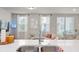 Modern kitchen seamlessly flows into the living area, creating a bright and inviting space for entertaining and everyday living at 2052 Milkweed St, Ocoee, FL 34761