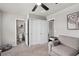 Spacious bedroom featuring double closets, carpet flooring, and access to the bathroom at 2052 Milkweed St, Ocoee, FL 34761