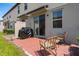 Cozy patio featuring brick pavers, wicker chairs, grill, and outdoor space at 2052 Milkweed St, Ocoee, FL 34761