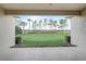 Covered patio framing a serene backyard view with a spacious green lawn and line of trees at 2282 Kaley Ridge Rd, Clermont, FL 34715
