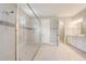 Spacious bathroom features a glass-enclosed shower with decorative tile accents and a large vanity at 2282 Kaley Ridge Rd, Clermont, FL 34715
