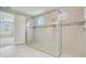 Modern bathroom features a glass shower enclosure with decorative tile accents and a window for natural light at 2282 Kaley Ridge Rd, Clermont, FL 34715