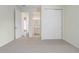 Bedroom with carpet and a closet with sliding doors and an attached bathroom at 2282 Kaley Ridge Rd, Clermont, FL 34715