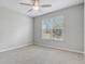 Bedroom with a ceiling fan and a window letting in natural light at 2282 Kaley Ridge Rd, Clermont, FL 34715