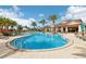 Large community pool with shallow areas, poolside seating, and a nearby covered pavilion at 2282 Kaley Ridge Rd, Clermont, FL 34715