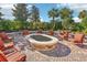 Outdoor fire pit area with comfortable seating, perfect for gatherings and enjoying the outdoors at 2282 Kaley Ridge Rd, Clermont, FL 34715