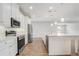 Contemporary kitchen with stainless steel appliances, center island, pendant lighting, and ample counter space at 2282 Kaley Ridge Rd, Clermont, FL 34715