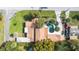 Aerial view of the property showcasing its layout, pool, and mature landscaping at 26 Backspin Ln, Orlando, FL 32804