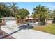 Secluded backyard featuring a private pool, mature palms, and a spacious two-car garage at 26 Backspin Ln, Orlando, FL 32804