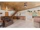 Finished basement with wood ceiling, tile floors, and stairway to main floor at 26 Backspin Ln, Orlando, FL 32804