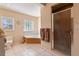 Bathroom featuring a corner tub with glass block window, and a tiled walk-in shower at 26 Backspin Ln, Orlando, FL 32804
