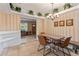 Bright dining area with striped walls, modern lighting, and access to the front room at 26 Backspin Ln, Orlando, FL 32804