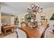 Elegant dining room with chandelier lighting, and easy access to the living room and kitchen at 26 Backspin Ln, Orlando, FL 32804
