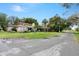 Charming single-Gathering home with well-maintained lawn, carport and mature trees in a quiet neighborhood at 26 Backspin Ln, Orlando, FL 32804