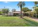 Charming single-Gathering home with a covered carport, well-manicured lawn, and mature trees at 26 Backspin Ln, Orlando, FL 32804