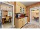 Charming kitchen with stainless steel appliances, light wood cabinets, and tiled floors at 26 Backspin Ln, Orlando, FL 32804