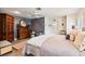 Spacious main bedroom with a ceiling fan, gray walls, seating area, and tiled floors at 26 Backspin Ln, Orlando, FL 32804