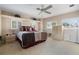 Bright main bedroom offering carpet, multiple windows, and neutral colors at 26 Backspin Ln, Orlando, FL 32804
