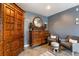 The main bedroom features a ceiling fan, seating area, and an antique dresser and armoire at 26 Backspin Ln, Orlando, FL 32804