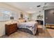 Comfortable main bedroom with large windows for natural light, a ceiling fan, and a writing desk at 26 Backspin Ln, Orlando, FL 32804