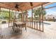 Covered patio featuring an outdoor dining area and a view of the sparkling pool at 26 Backspin Ln, Orlando, FL 32804