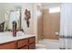 Bathroom showcasing a vanity, toilet, bathtub, and shower at 2613 Santosh Cv, Kissimmee, FL 34746