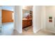 Bathroom featuring a wooden vanity, mirror, and neutral color scheme, seamlessly connecting to the bedroom at 2613 Santosh Cv, Kissimmee, FL 34746